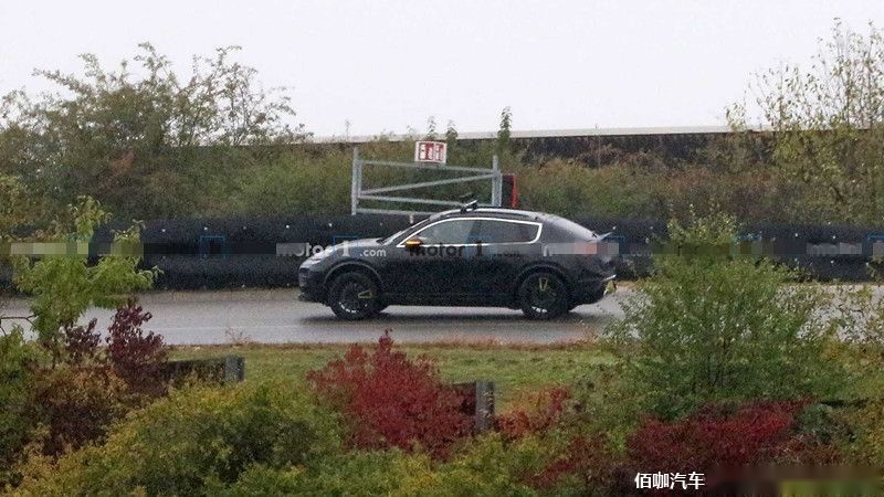 2022-porsche-macan-electric-first-spy-photo-rear-three-quarters (1).jpg