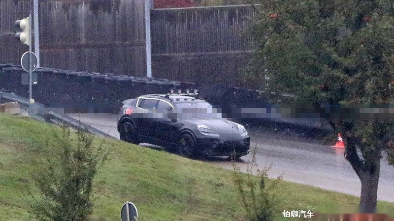 2022-porsche-macan-electric-first-spy-photo-front-three-quarters.jpg